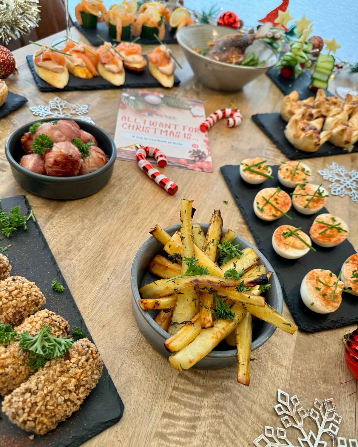 Festive canapés on slate boards with snowflake decorations at The Bank at Bude