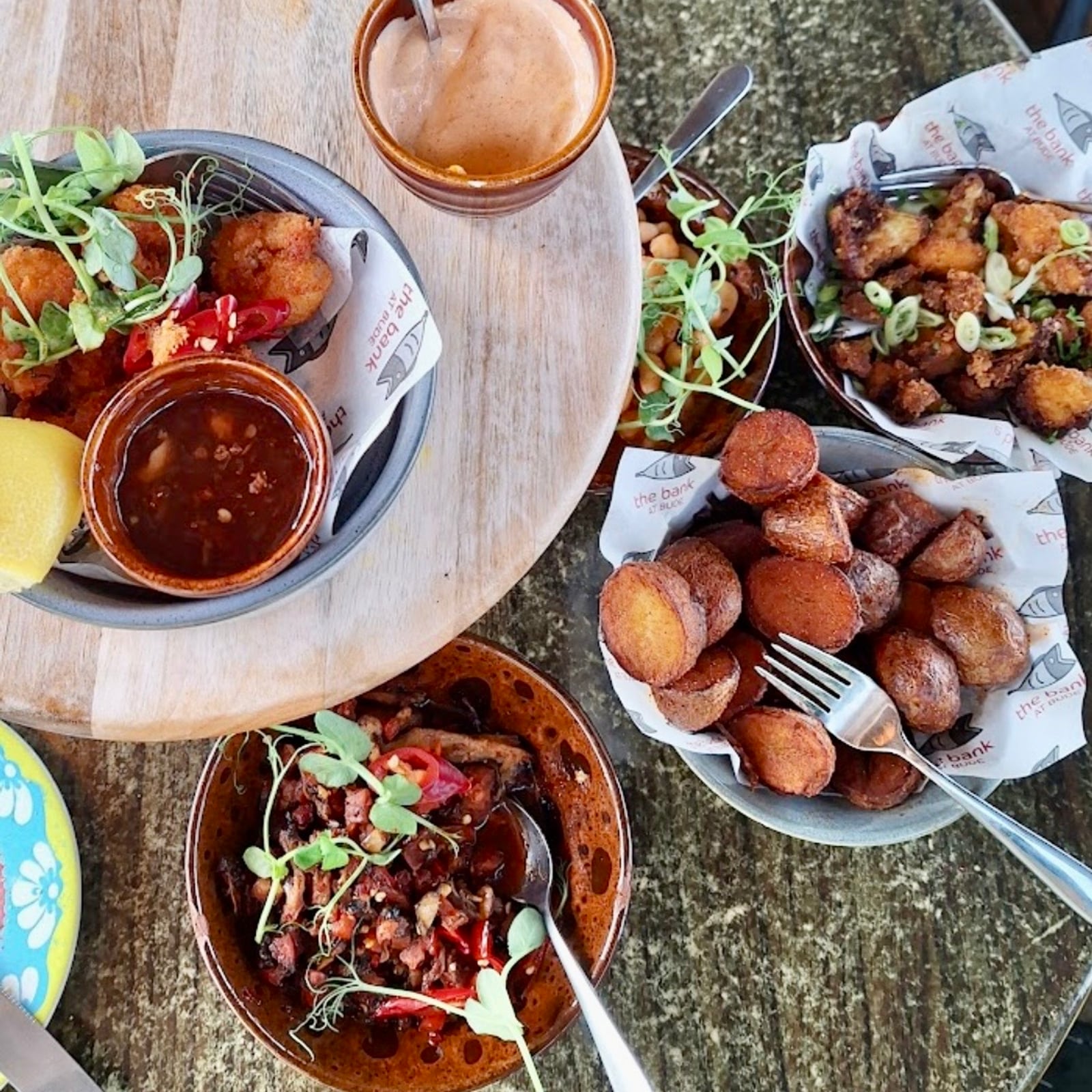 An overhead spread of Spanish-Cornish tapas plates made with fresh, locally sourced produce at The Bank at Bude