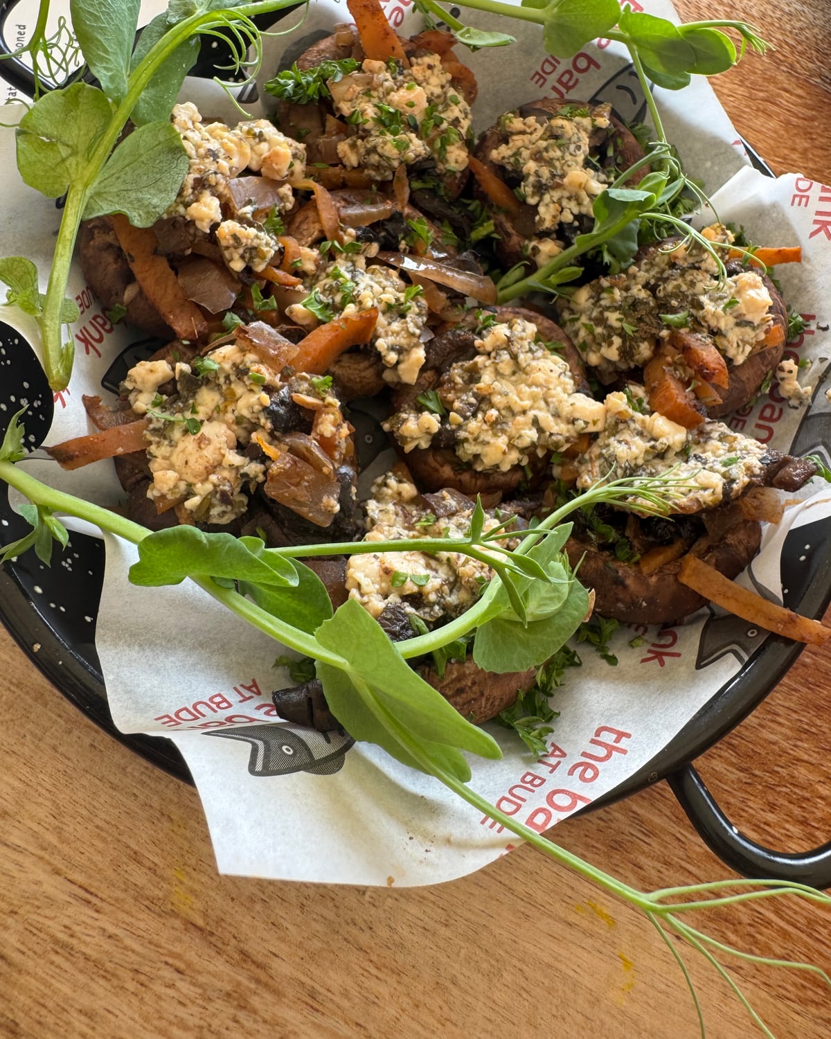 Stuffed mushrooms topped with a herby tofu crumble and pea shoots at The Bank at Bude