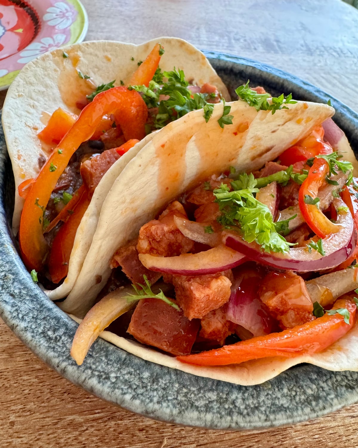 Soft tacos filled with pulled duck, peppers, red onion and salsa at The Bank at Bude